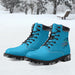 a pair of blue boots sitting in the snow