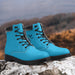 a pair of blue boots sitting on top of a rock