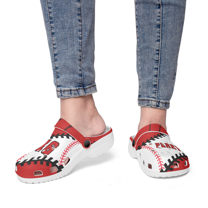 a woman's feet wearing red and white shoes