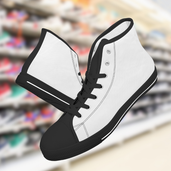 a pair of white and black shoes hanging from a rack