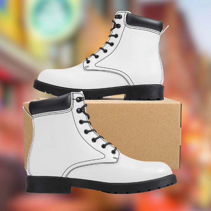 a pair of white boots sitting on top of a cardboard box